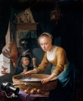 Jeune femme coupant des oignons